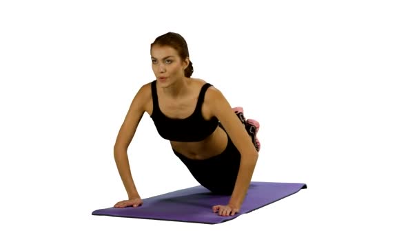 woman in a traditional yoga pose, white background, stretching. Gym