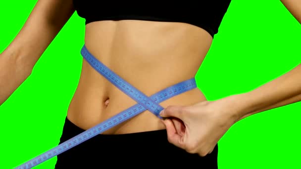 Fitness woman taking body measurements, sportswear. details, Green screen — Stock Video