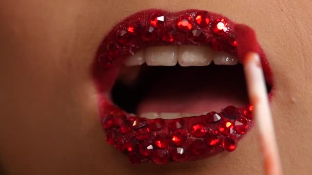 Luxury woman with rhinestones on her lips. Slow motion. close up — Stock Video
