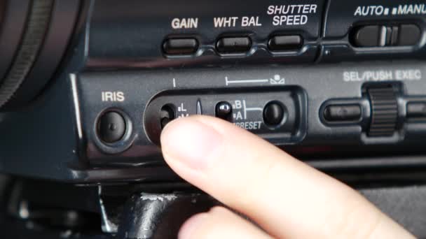 Finger pressing the button on camera, change, close up — Stock Video