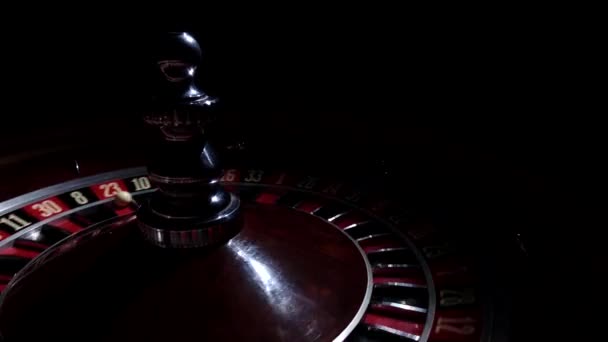 Roulette wheel fast running with white ball on 23, cam moves to the right, black — Stock Video