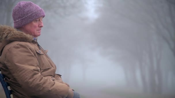 Mid Shot Sad Elderly Man Sits Himself Park Foggy Morning — Stock Video