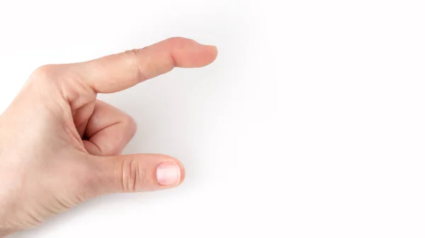 Фрагмент левой руки показывает размер, как большой указательным пальцем и большим пальцем Стоковое Фото
