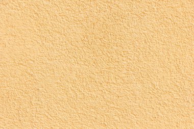 Şeftali rengi duvar dokusu. Sıcak bej arka plan. Duvar arkaplanı.