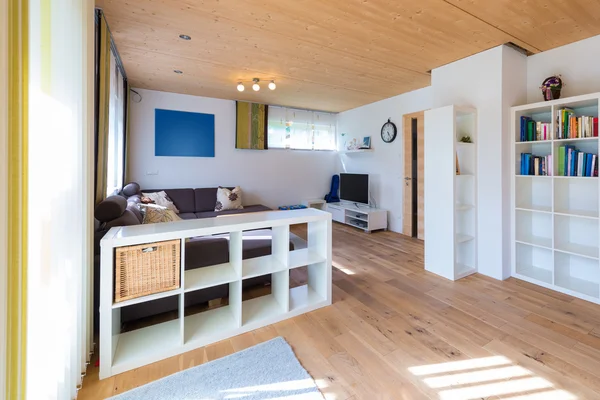 Indoor shot of living room with wooden floor in a timber house — Stock Photo, Image