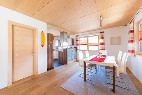 Wooden warm mud of kitchen and dining room in timber house — Stock Photo, Image