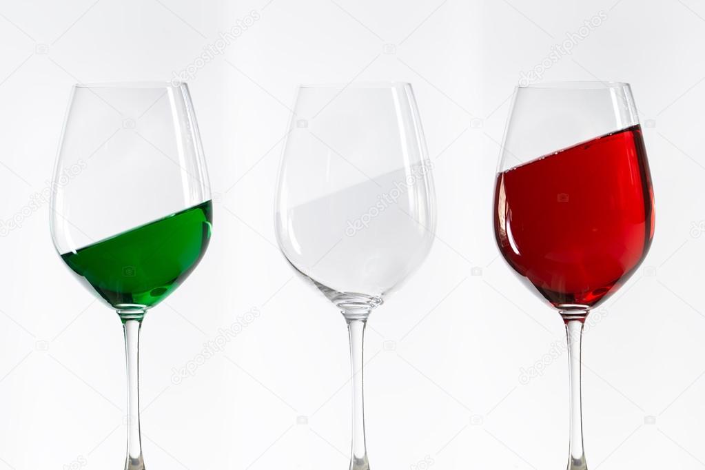 Three wine glasses filled with the colors of the italy flag
