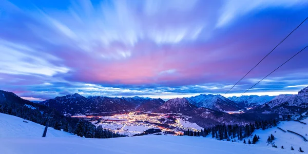 Dynamic clouds over valley at winter night in tirol mountains — Stock Photo, Image