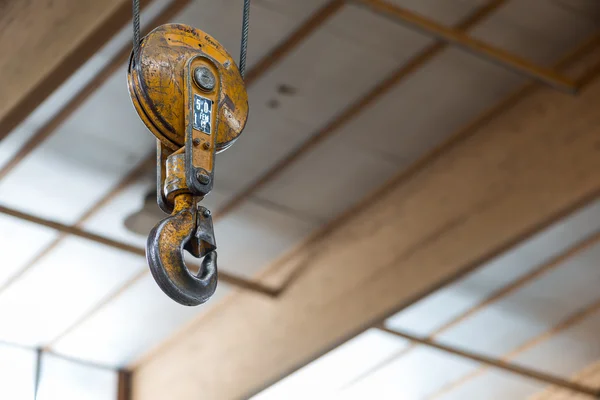 Yellow clevis sling load hook with latch of carpentry workshop — Stock Photo, Image