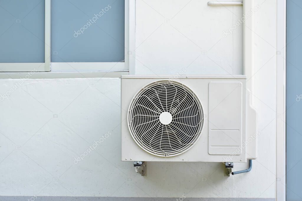 Exhaust fan of air conditioners which installed on the house wall in Asian countries. Soft and selective focus.