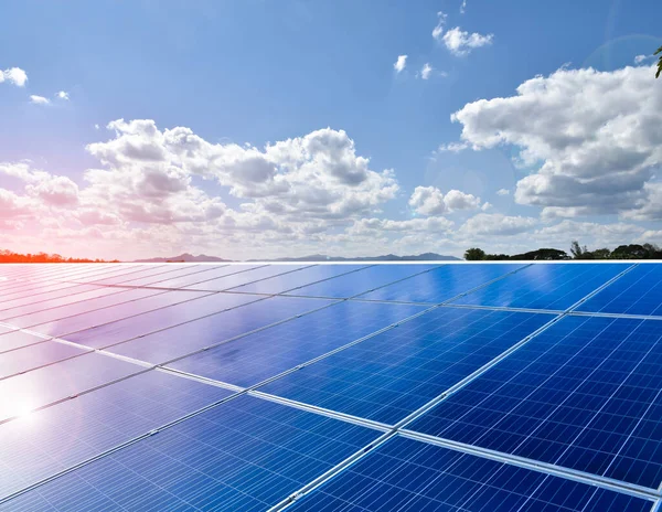 Solar rooftop of the building, cloudy and bluesky background. Soft and selective focus on solar panels.