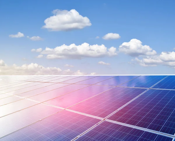 Solar rooftop of the building, cloudy and bluesky background. Soft and selective focus on solar panels.