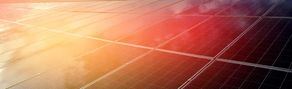 closeup photovoltaic panels which installed on the rooftop of the building, concept for storing and using natural power from the sunlight to care about human environment over the world.