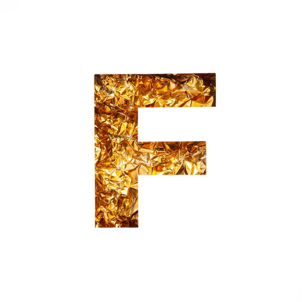 Gilded letter F of English alphabet of glittering crumpled foil and paper cut isolated on white. Xmas golden typeface — Stock Photo, Image