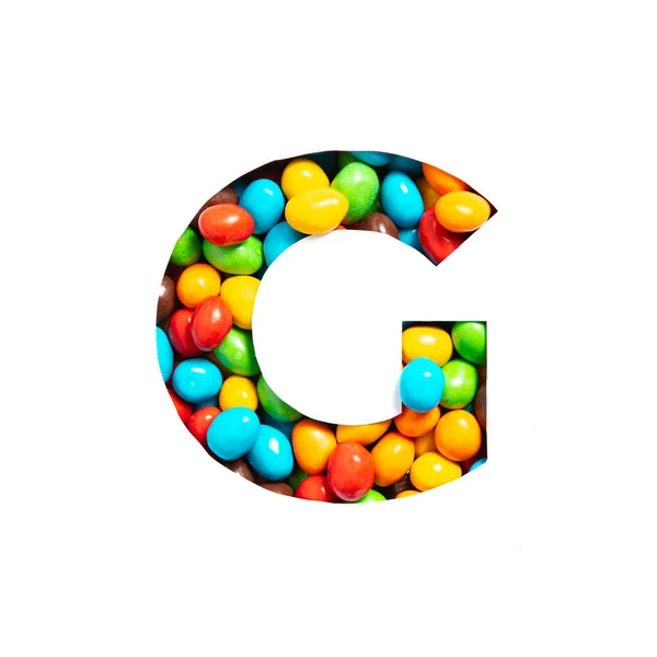 Letter G of English alphabet of multicolored candies and paper cut isolated on white. Typeface for festive design — Stock Photo, Image