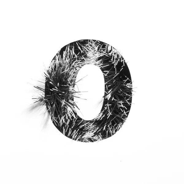 Black number zero made of monochrome tinsel and paper cut null shape isolated on white. Typeface for minimalistic design — Stock Photo, Image