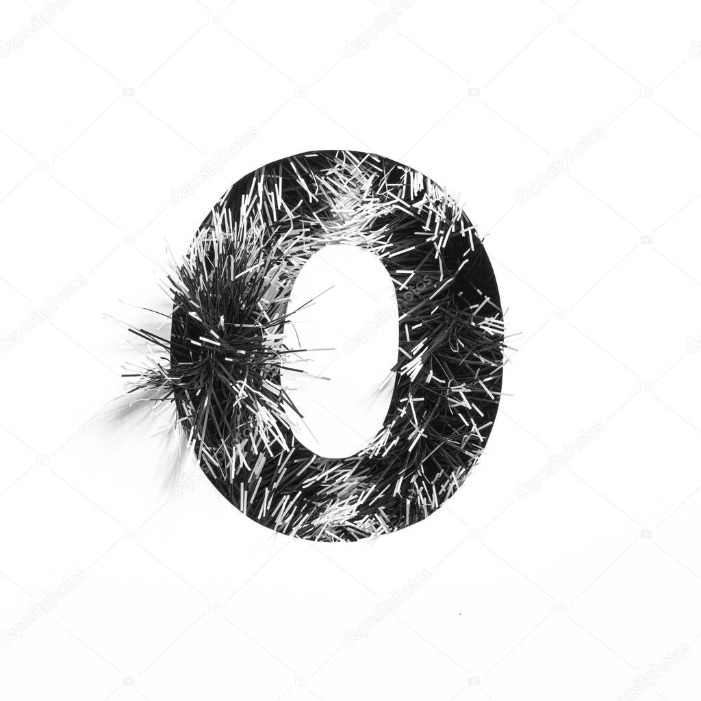 Black number zero made of monochrome tinsel and paper cut null shape isolated on white. Typeface for minimalistic design