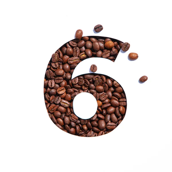 Numero sei fatto di chicchi di caffè e carta tagliata a forma di sesto numero isolato su bianco — Foto Stock