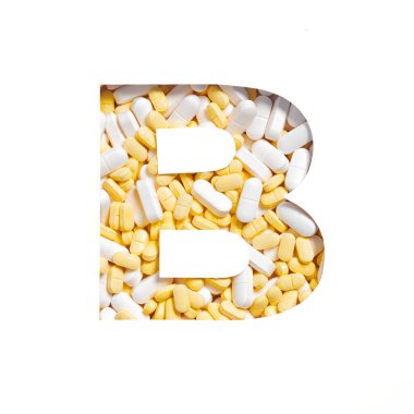 İlaç, takviye veya vitamin tabletleri. Alfabenin B harfi beyaza izole edilmiş. Eczane için verilen hapların yazı tipi