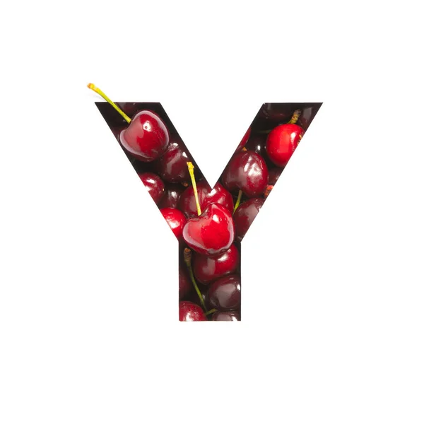 Буква Y английского habet сделана из натуральной вишни и бумаги, вырезанной на белом фоне. Шрифт из ягод — стоковое фото