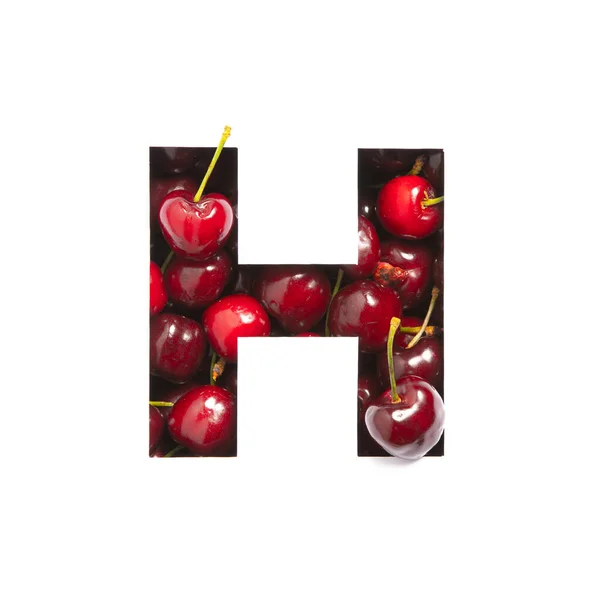 Kirschen-Alphabet. Buchstabe H aus Beeren und Papier isoliert auf weiß geschnitten. Schrift für den Bio-Lebensmittelmarkt. Vitamine — Stockfoto