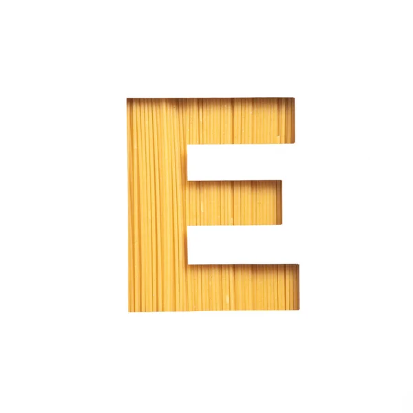 Italian Food. Letter E of English alphabet made of spaghetti isolated on white. Pasta Typeface for products store design — Stock Photo, Image