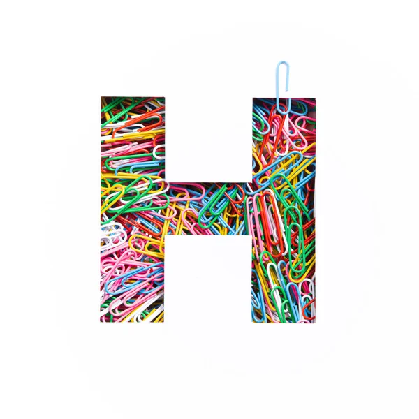 Letter H of English alphabet of colourful rainbow paperclips, white cut paper sheet. Typeface of stationery — Stock Photo, Image