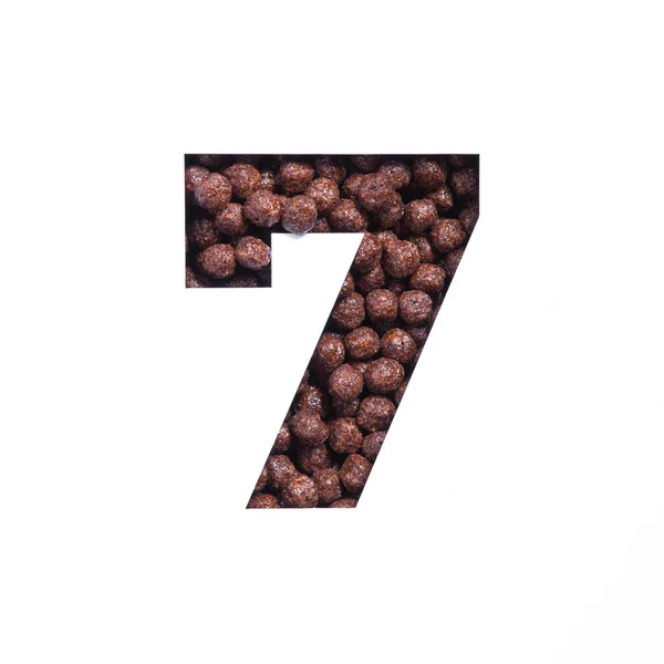 Nummer sieben der nahrhaften Müslibällchen aus Schokolade, weiß geschnittenes Papier. Siebte Ziffer. Schrift für gesunde Ernährung — Stockfoto