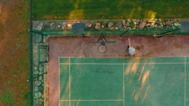 Basketball Concept. Sport court outdoor. Aerial drone establishing view from above. Basketball player workout — Stock Video