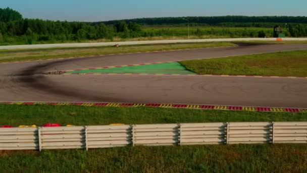 Kart racing on circuits, aerial view . Sports car for professional karting moving on racetrack. Race training — Stock Video