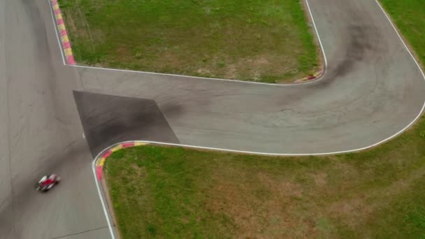 Karting race track, aerial view 4k video. Kart racing around curve. Sport competition concept — Stock Video