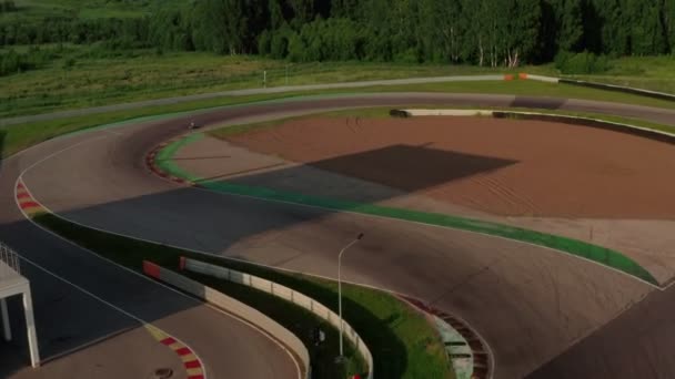 Kart racing or karting training. Professional kart, go-kart moving on race track. Aerial view of auto circuit — Stock Video