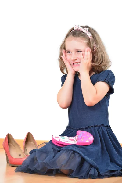 Happy little girl prepared for a make-up — Stock Photo, Image