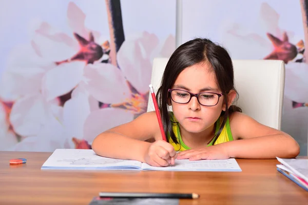 Little cute girl doing homework — Stock Photo, Image
