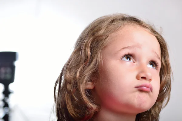 Little girl visiting a photo studio — Stock Photo, Image