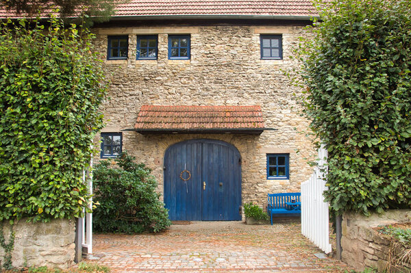 Historic house with blue door in Florsheim Dalsheim, Germany.