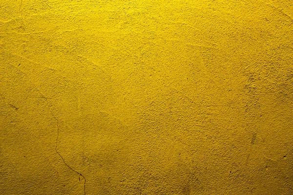 金や黄色の異なる色合いのテクスチャと黄色の抽象的な壁の背景 — ストック写真