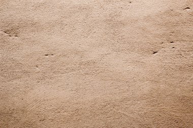 Krem veya bej rengi farklı tonlarda bej renkli duvar dokusu arkaplanı