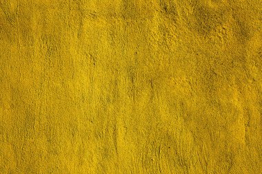 Sarı renkli soyut duvar arkaplanı. Altının farklı tonlarında veya sarı.