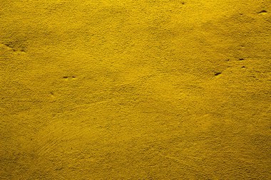 Sarı renkli soyut duvar arkaplanı. Altının farklı tonlarında veya sarı.