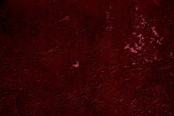 Crimson colored wall background with textures of different shades of crimson red