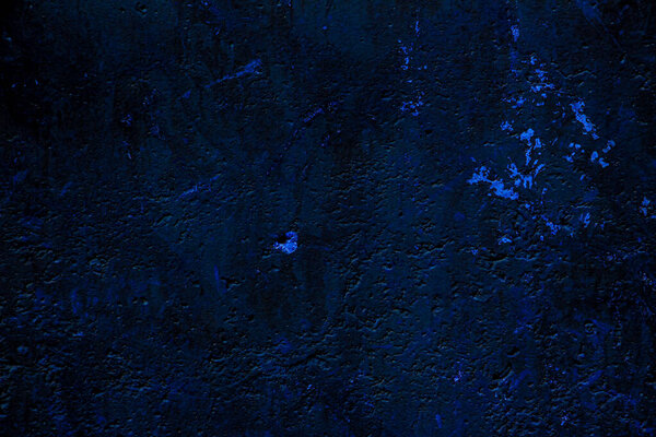 Blue colored abstract wall background with textures of different shades of blues