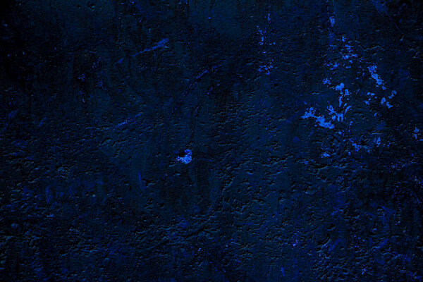 Blue colored abstract wall background with textures of different shades of blues