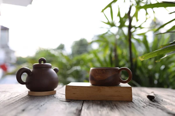 Brown Wooden Cup Traditional Clay Tea Pot Thick Old Book — Stock Photo, Image