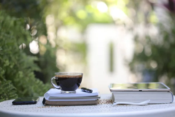 Black Coffee Transparent Glass Notebook Tablet Phone White Metal Table — Stock Photo, Image