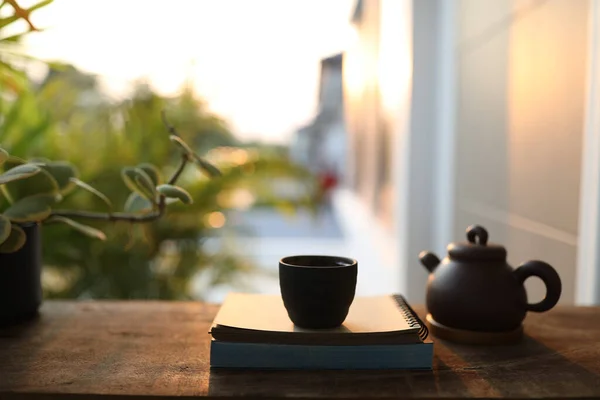 Asian Teapot Black Cup Notebook Wooden Table Sunset Light — Stock Photo, Image