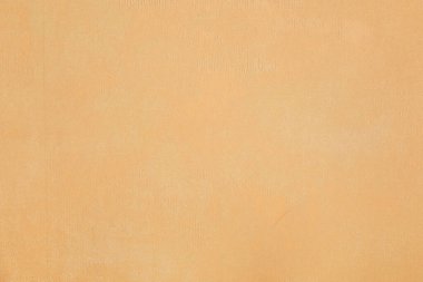 Old brown fabric surface with subtle abstract patterns