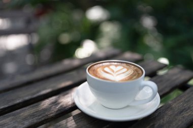 Mocha coffee in a white cup on rustic grunge table