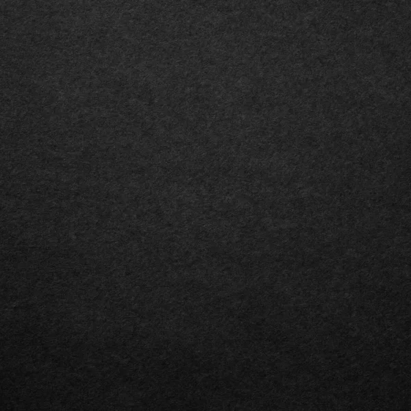 Black square paper surface with grainy texture