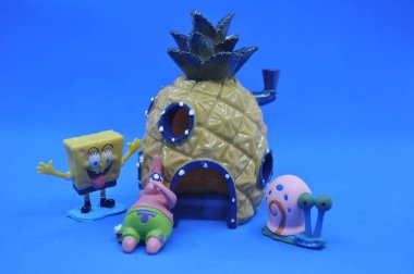 Kuching, Sarawak Malaysia - February 5 2021: The Spongebob Squarepants, his friends, and buildings in 3D resin figurines clipart
